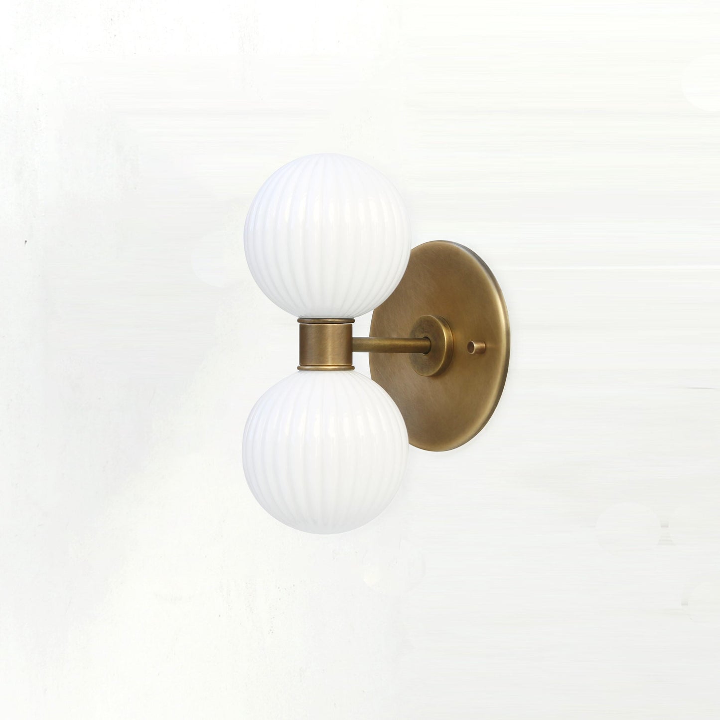 Two-Light Vertical Brass Wall Sconce with Ribbed Opal Globes