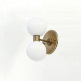Two-Light Vertical Brass Wall Sconce with Ribbed Opal Globes