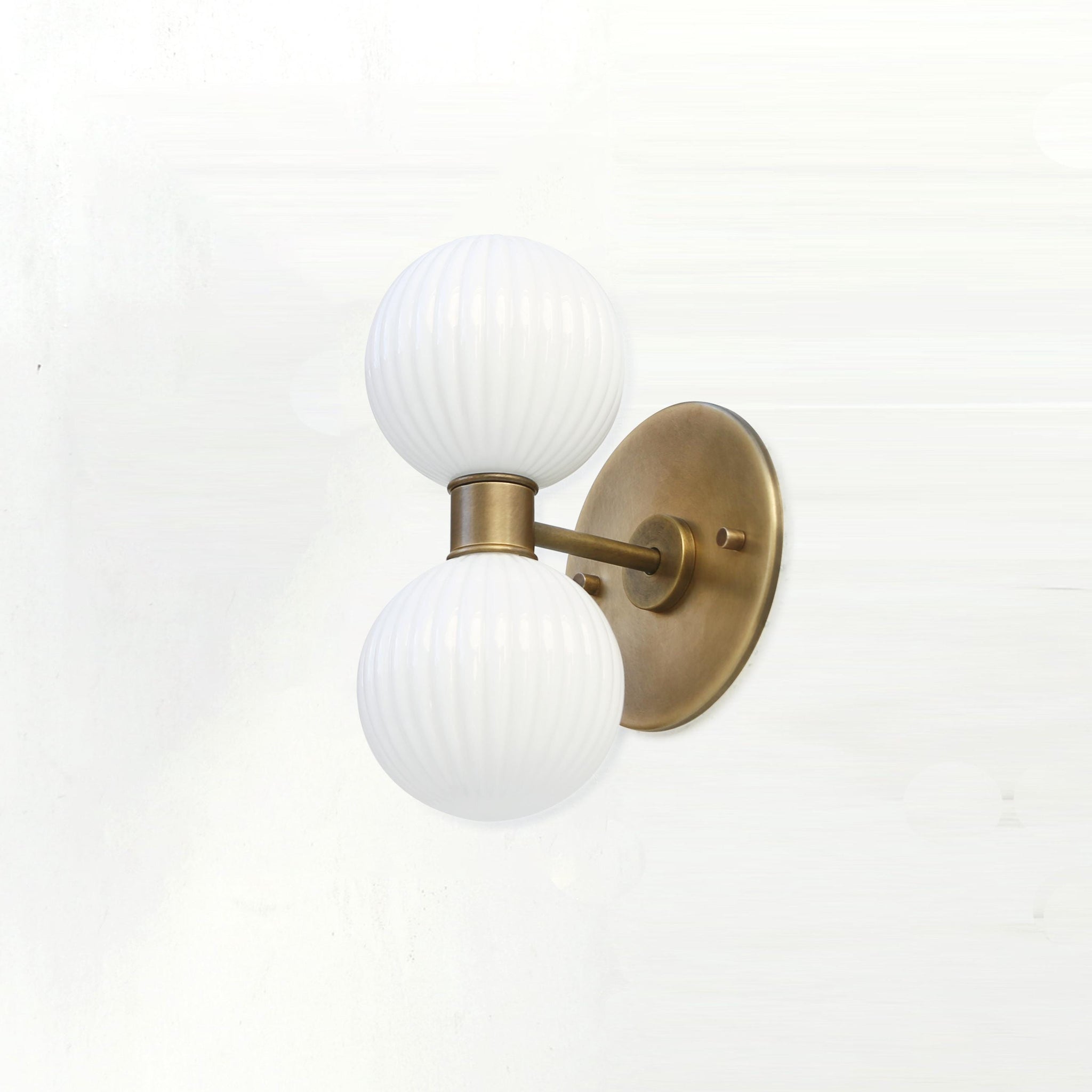 Two-Light Vertical Brass Wall Sconce with Ribbed Opal Globes