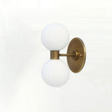 Two-Light Vertical Brass Wall Sconce with Ribbed Opal Globes