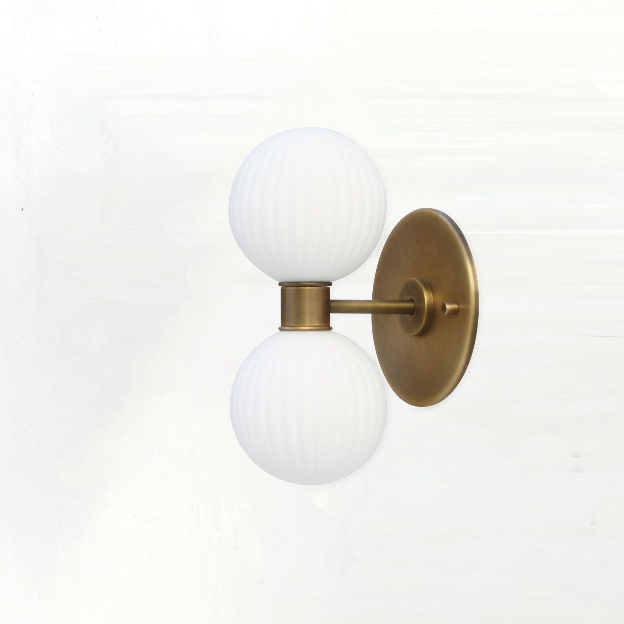 Two-Light Vertical Brass Wall Sconce with Ribbed Opal Globes