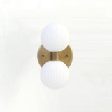 Two-Light Vertical Brass Wall Sconce with Ribbed Opal Globes