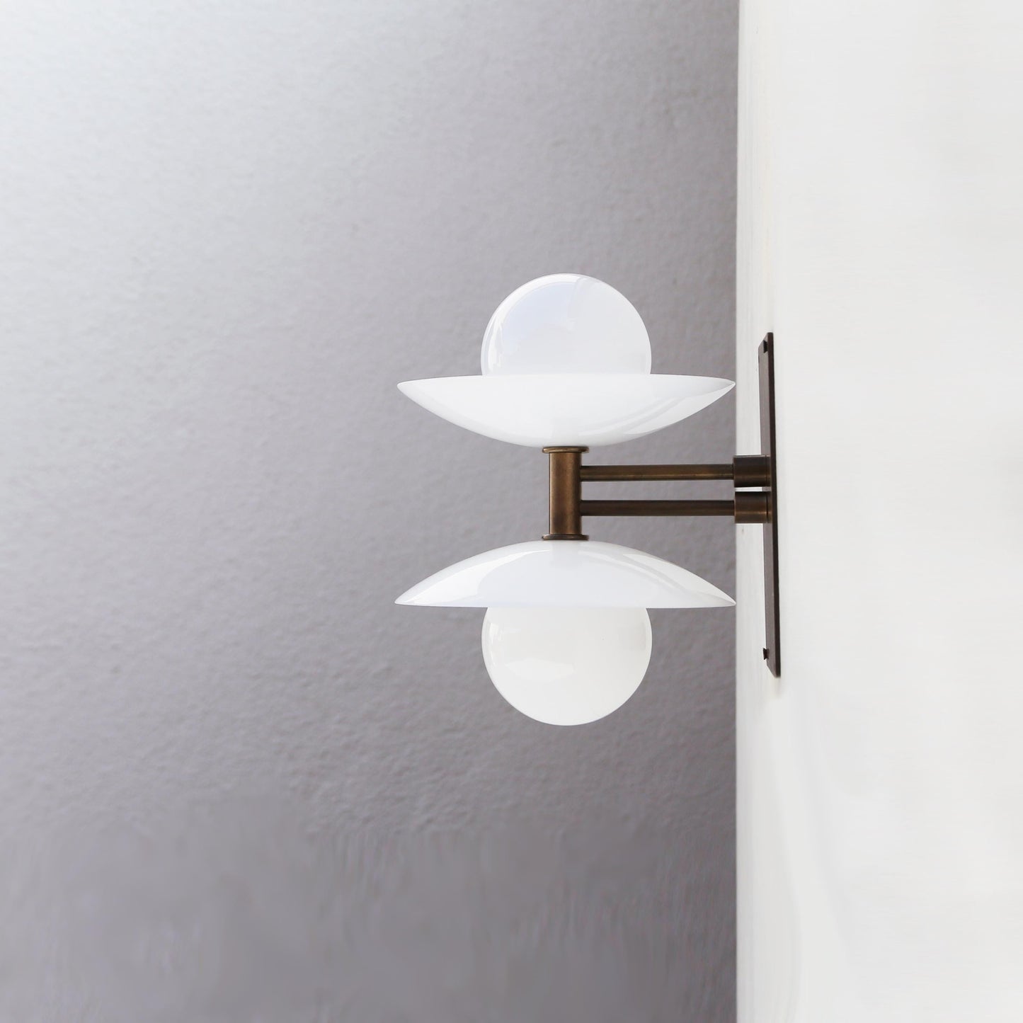 Two-Light Wall Sconce with Stacked Opal Glass Cone Shades