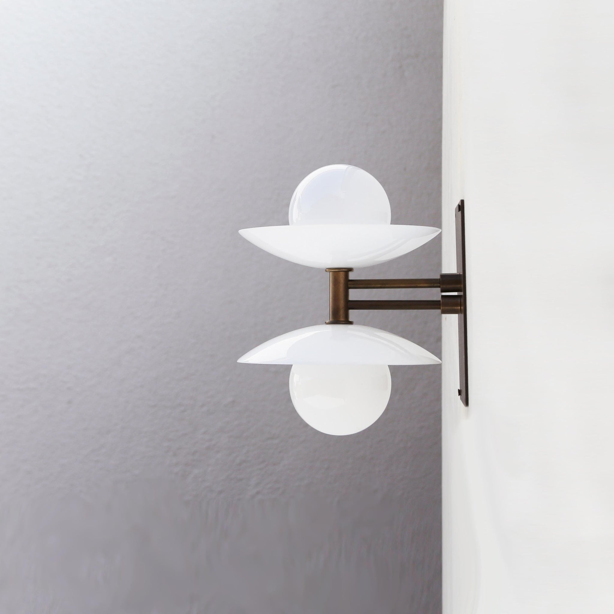 Two-Light Wall Sconce with Stacked Opal Glass Cone Shades
